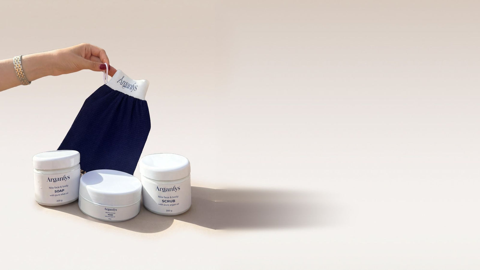 Arganlys Nila soap, scrub, mask and kessa glove on Moroccan rock